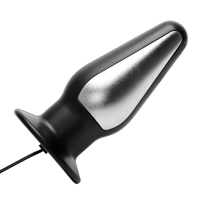 eros sex toys Torture of Andreev cross on the bedroom wall. VDSM equipment and sex toys.  Leather handcuffs with a chain on a gray sheet. The lashes hang in the room  for perversions. — Stock main image 0